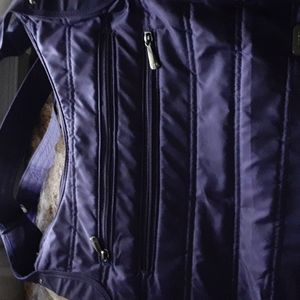 Great Lug shoulder/crossbody bag. Adjust strap.Side opens for water/unbrella